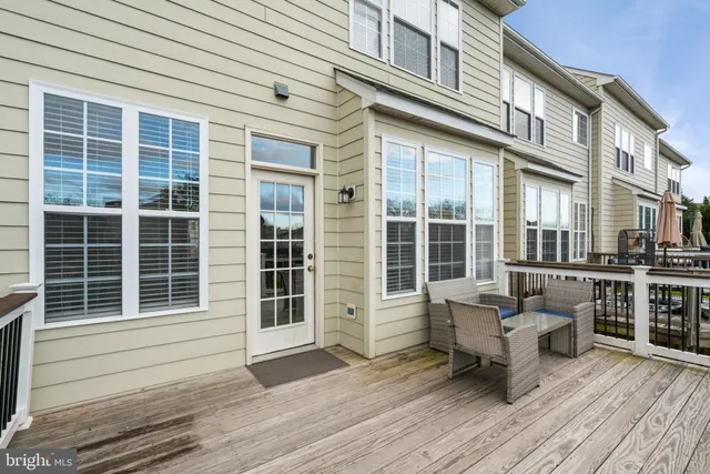 a balcony with furniture and wooden floor