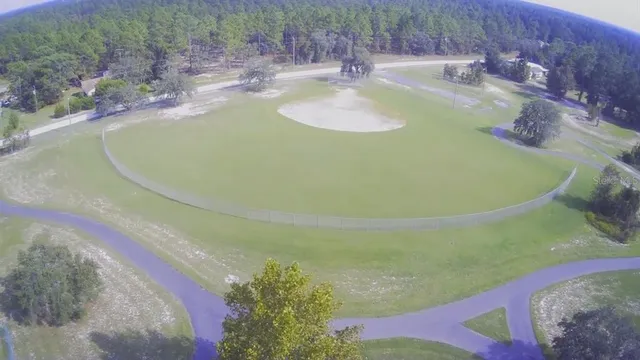 an aerial view of a house with outdoor space