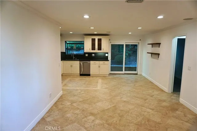 a view of kitchen with refrigerator sink and microwave