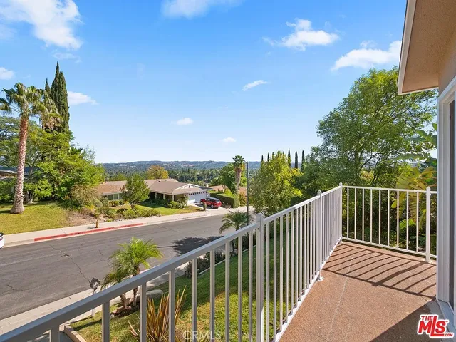 a view of a street with sitting space