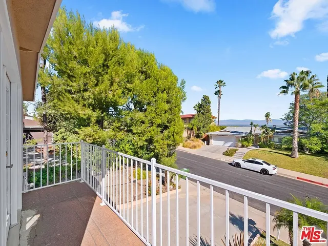 a view of a balcony with lake view