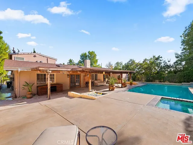 a view of a house with outdoor space and sitting area