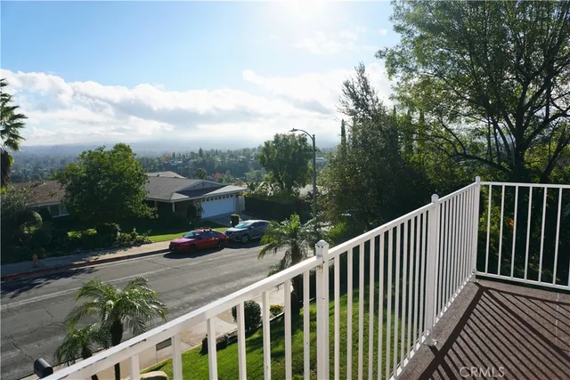 a view of street from a balcony