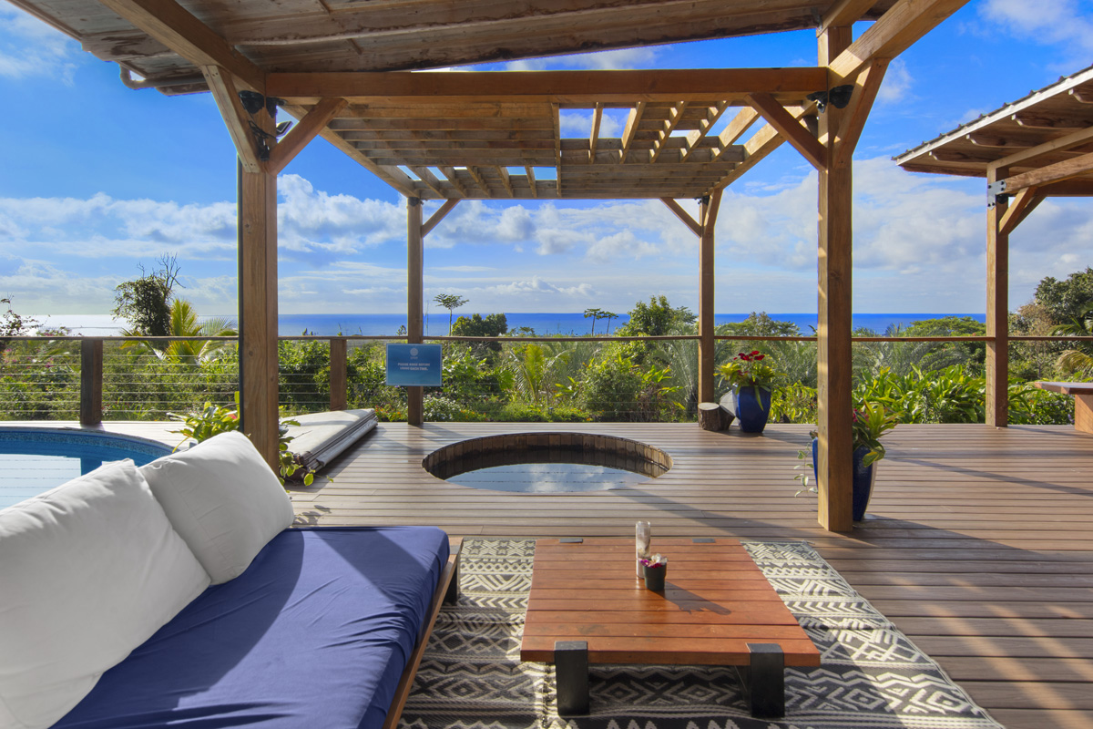 12-1098 Kaimu-Makena Homestead Road Pahoa, HI 96778 - Photo 1 of 29 a view of patio with table and chairs with wooden floor and fence