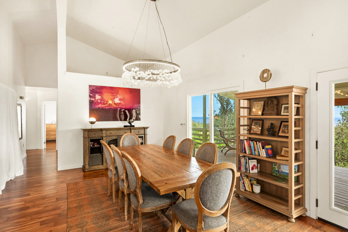 12-1098 Kaimu-Makena Homestead Road Pahoa, HI 96778 - Photo 14 of 29 a dining room with furniture a chandelier and wooden floor