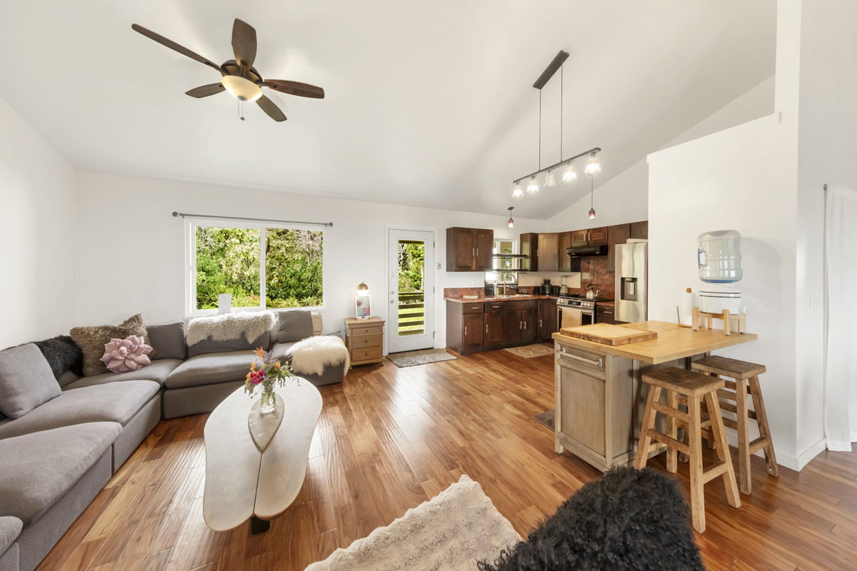 12-1098 Kaimu-Makena Homestead Road Pahoa, HI 96778 - Photo 15 of 29 a living room with furniture kitchen view and a wooden floor