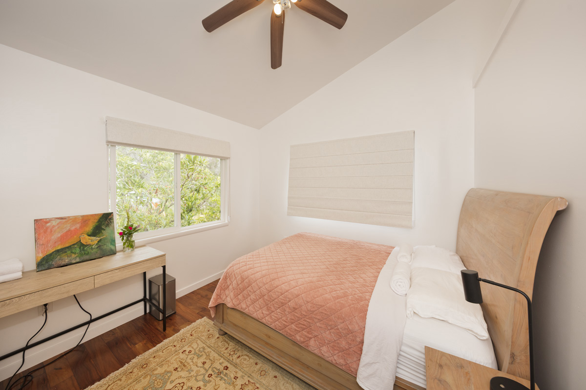 12-1098 Kaimu-Makena Homestead Road Pahoa, HI 96778 - Photo 20 of 29 a bedroom with a bed a chair and a large window