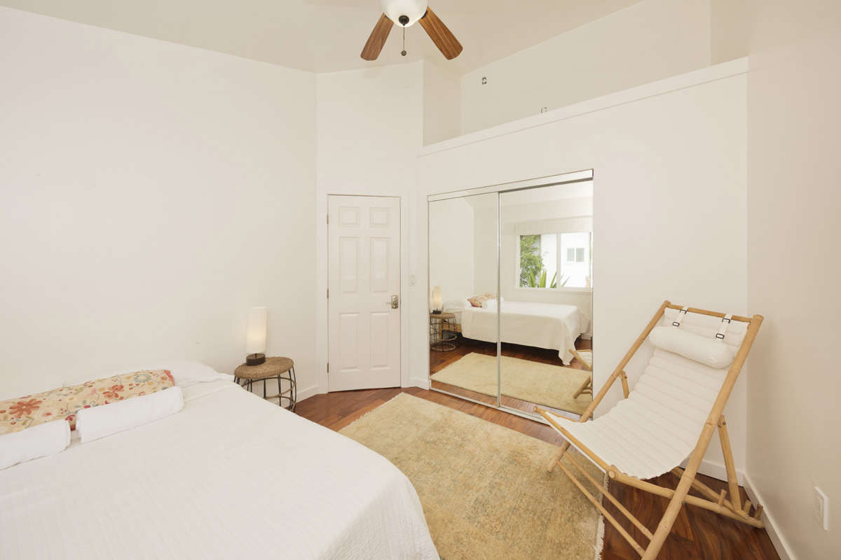 12-1098 Kaimu-Makena Homestead Road Pahoa, HI 96778 - Photo 21 of 29 a bedroom with a bed and a chair