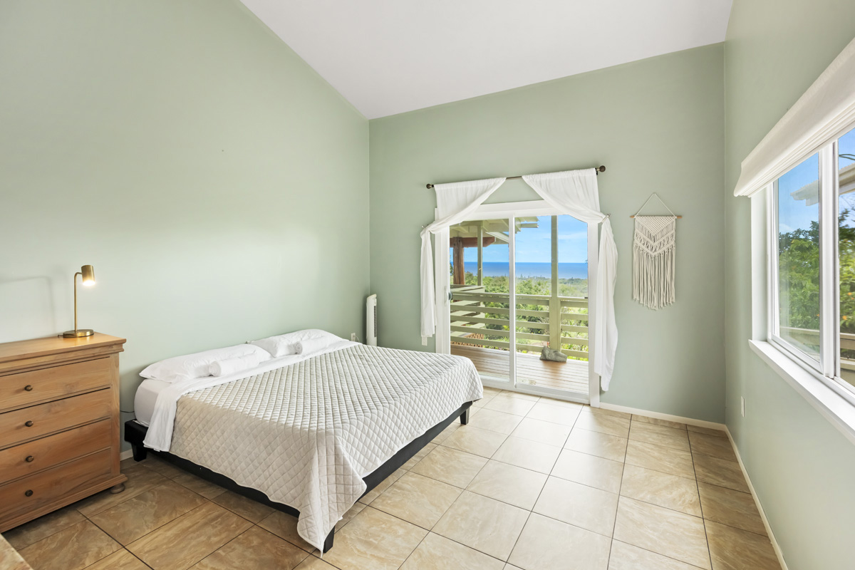 12-1098 Kaimu-Makena Homestead Road Pahoa, HI 96778 - Photo 22 of 29 a bedroom with a bed and a window