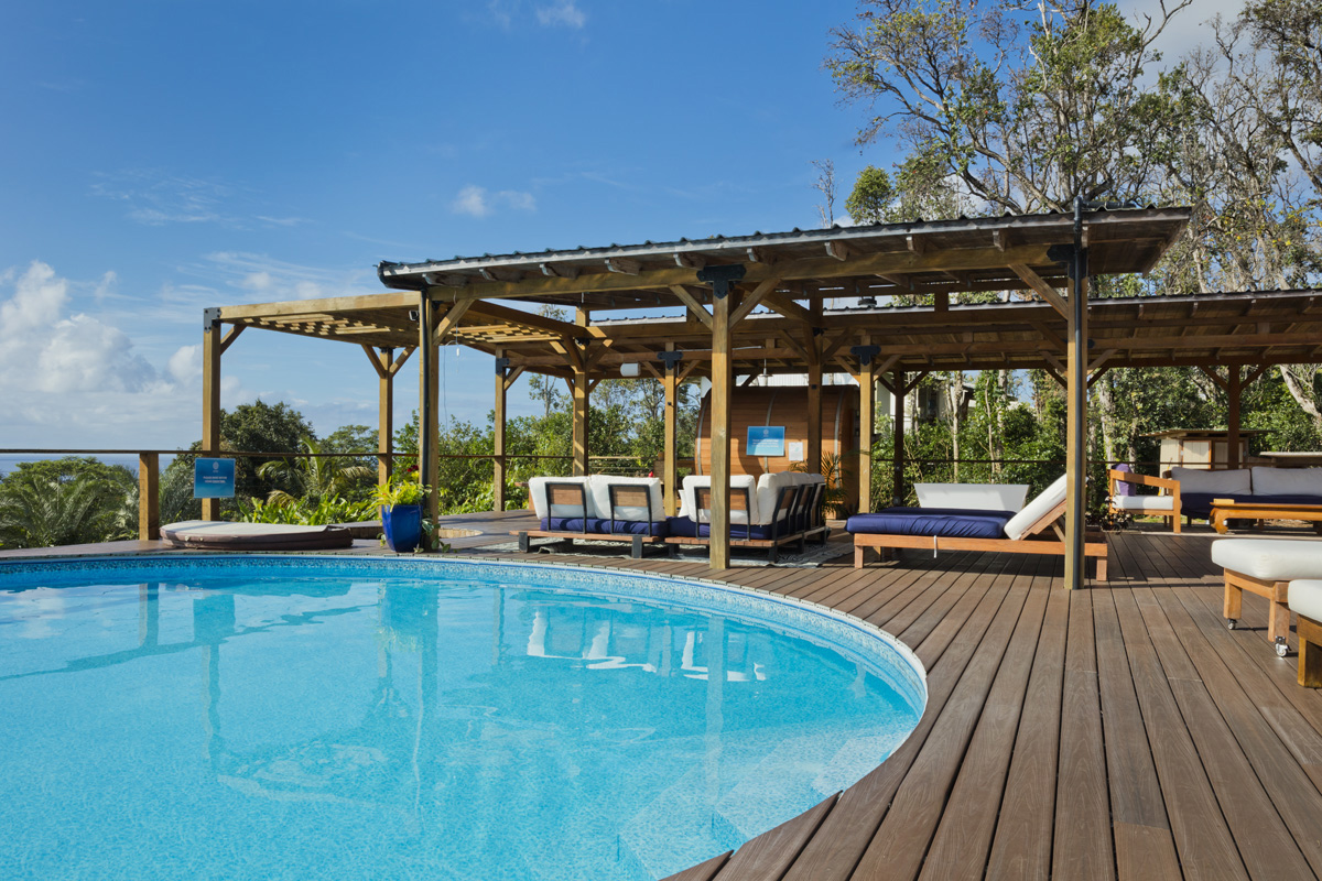 12-1098 Kaimu-Makena Homestead Road Pahoa, HI 96778 - Photo 3 of 29 an outdoor view of swimming pool with lounge chair