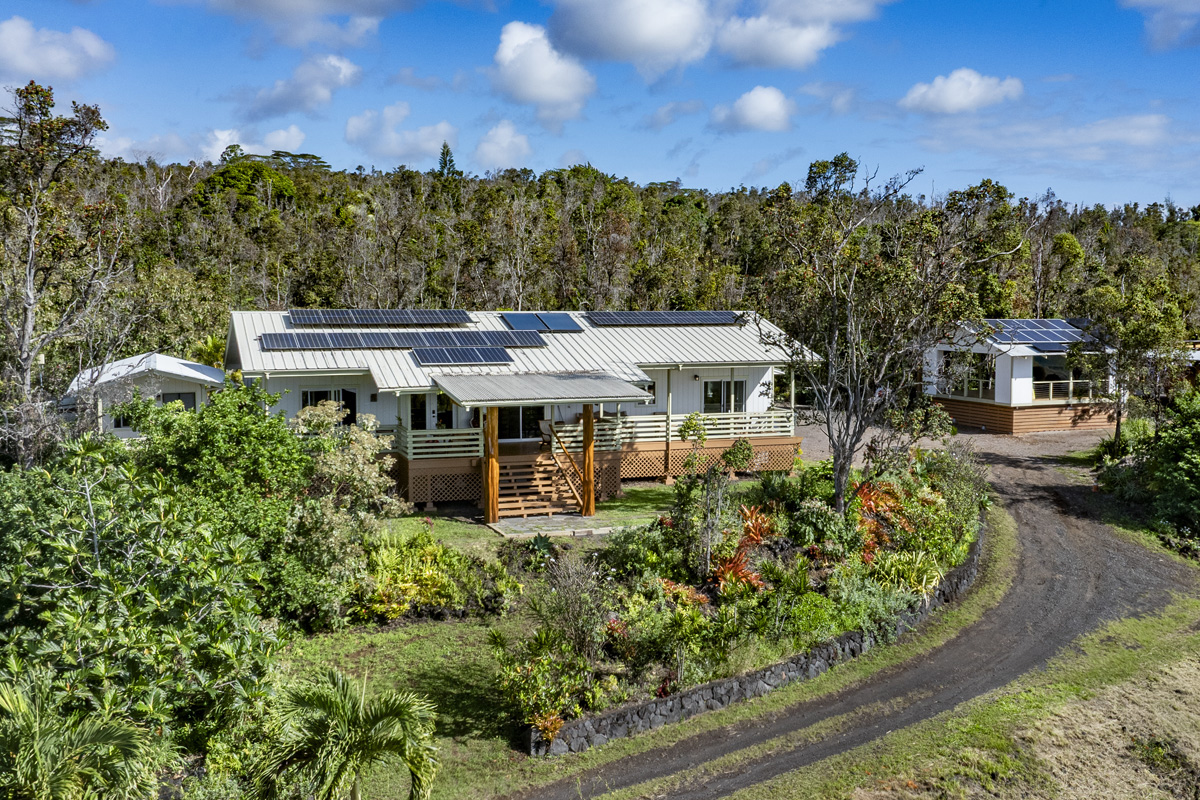 12-1098 Kaimu-Makena Homestead Road Pahoa, HI 96778 - Photo 9 of 29 a view of a house with a flower garden