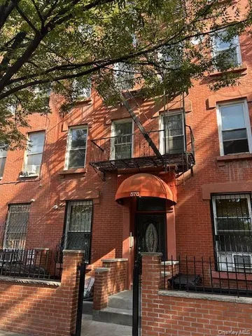a front view of a house with glass windows