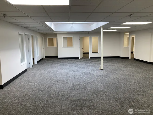 a view of a livingroom with furniture and cabinet area