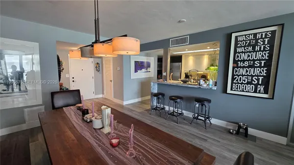 a living room with furniture rug and a table