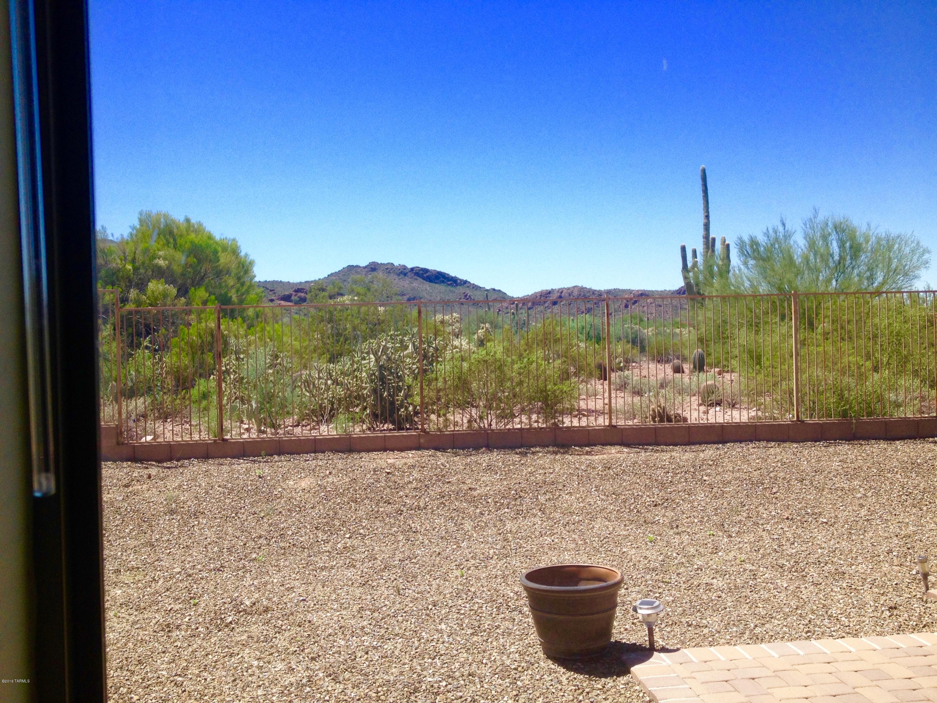 7931 North Iron Ridge Drive Tucson, AZ 85743 - Photo 16 of 21 a view of a terrace with a water view and mountain view