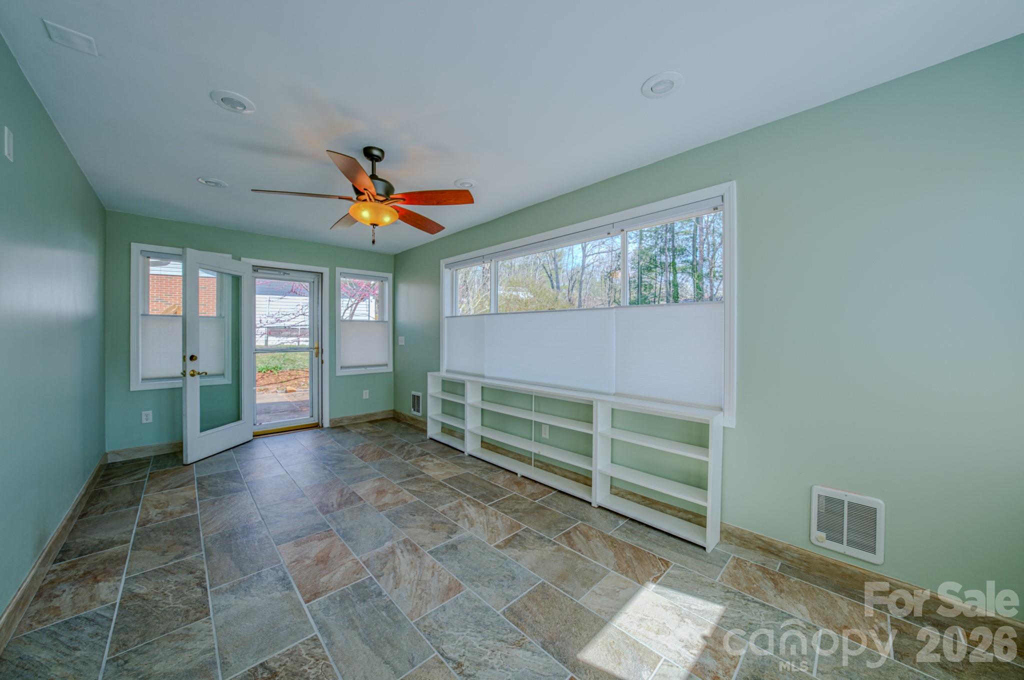 31 Knoll Ridge Drive Asheville, NC 28804 - Photo 15 of 30 a room with window and a ceiling fan