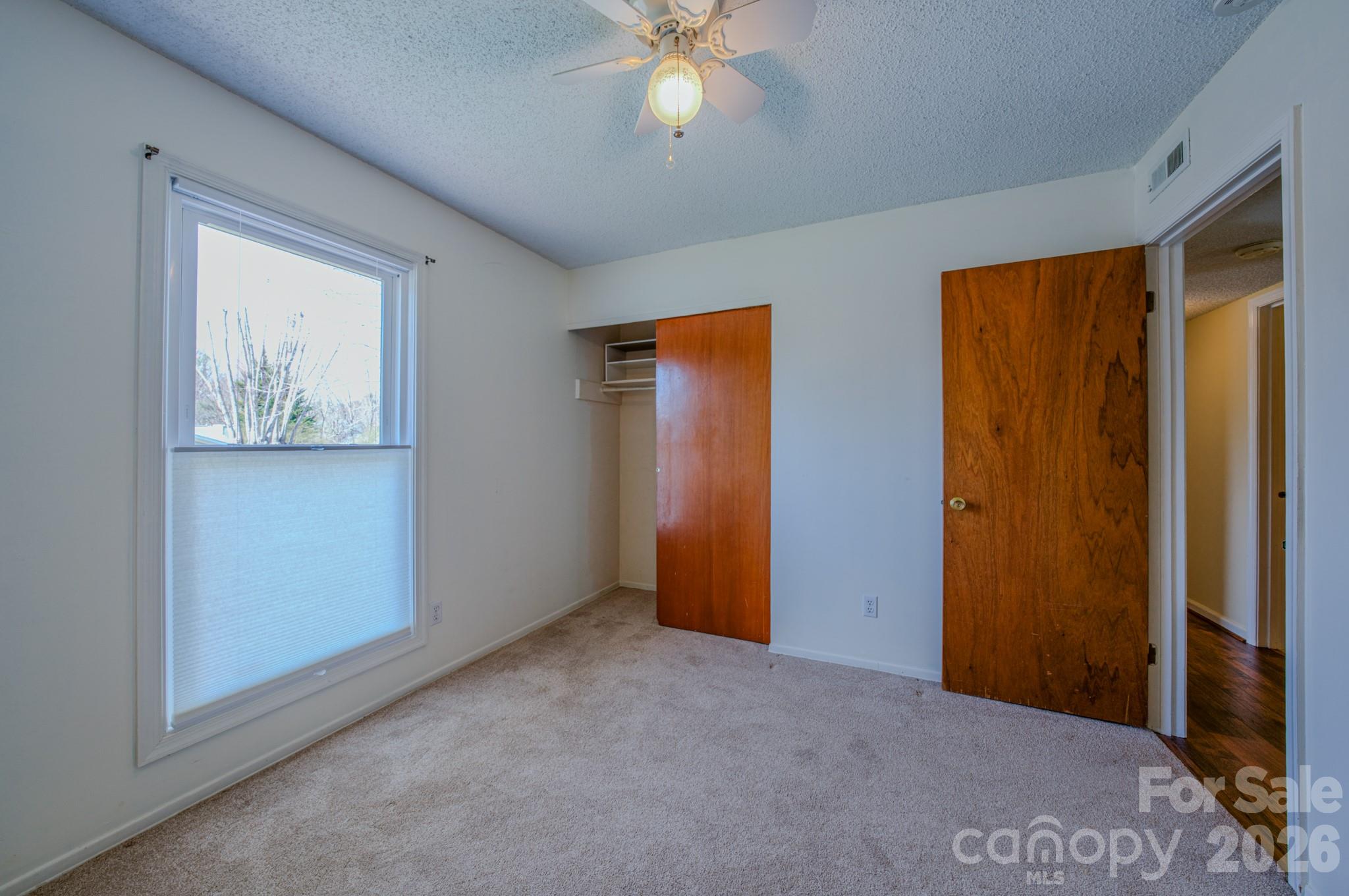 31 Knoll Ridge Drive Asheville, NC 28804 - Photo 19 of 30 a view of an empty room with window and closet area
