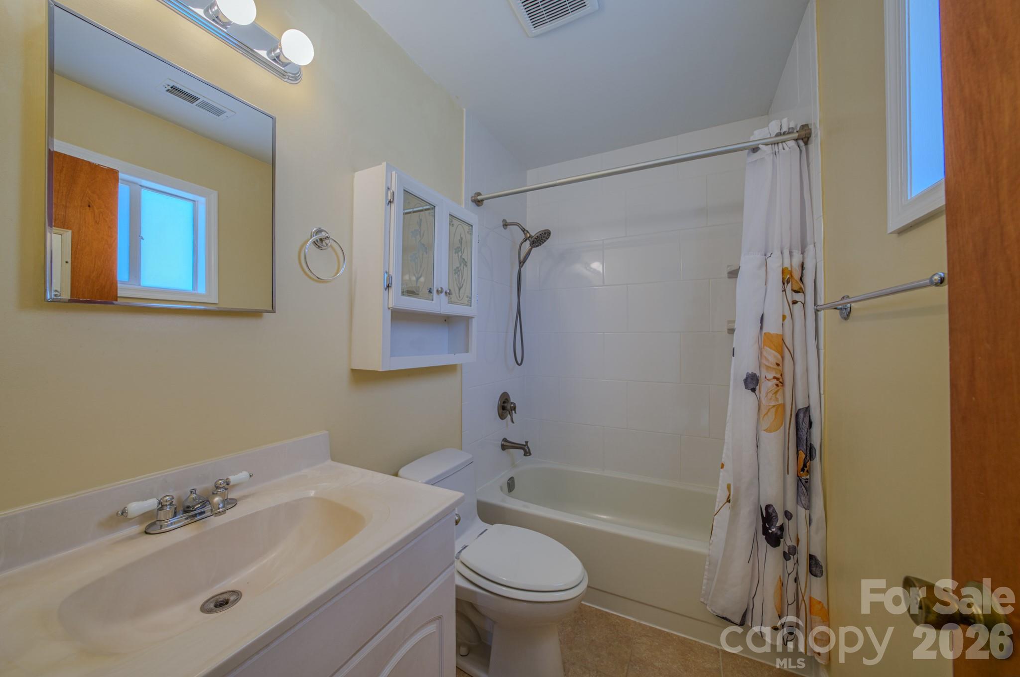 31 Knoll Ridge Drive Asheville, NC 28804 - Photo 22 of 30 a bathroom with a sink toilet and shower