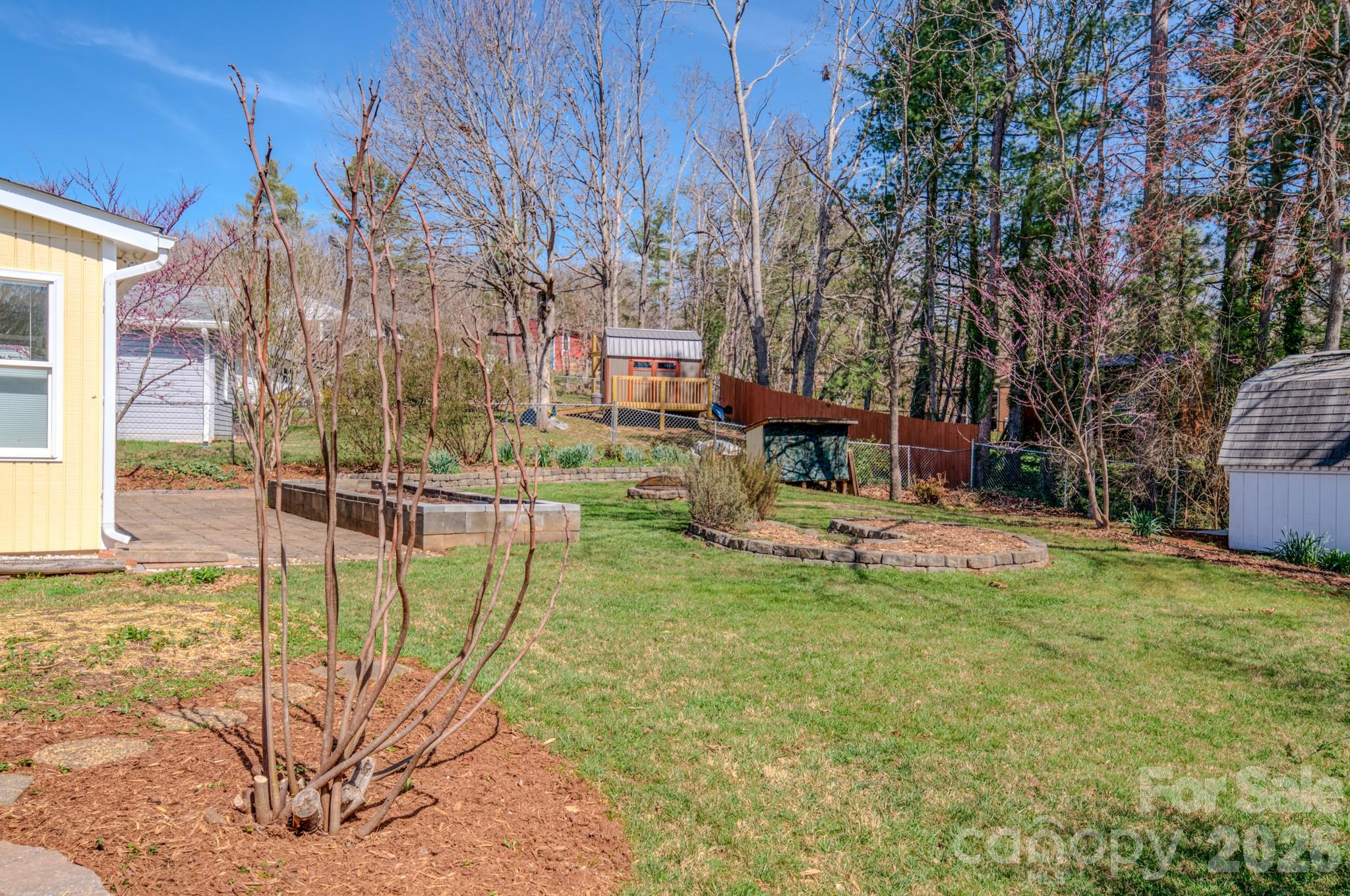31 Knoll Ridge Drive Asheville, NC 28804 - Photo 3 of 30 a view of a chairs and table in backyard