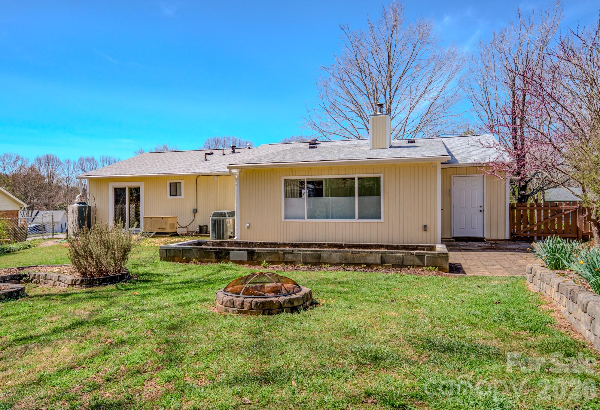 31 Knoll Ridge Drive Asheville, NC 28804 - Photo 5 of 30 a view of a house with backyard and sitting area