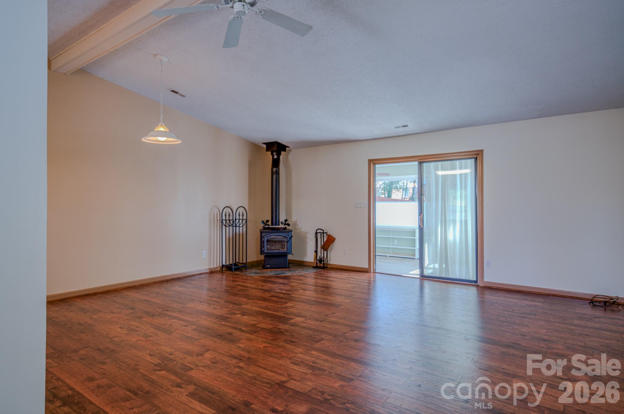31 Knoll Ridge Drive Asheville, NC 28804 - Photo 9 of 30 a view of an empty room with a window and wooden floor