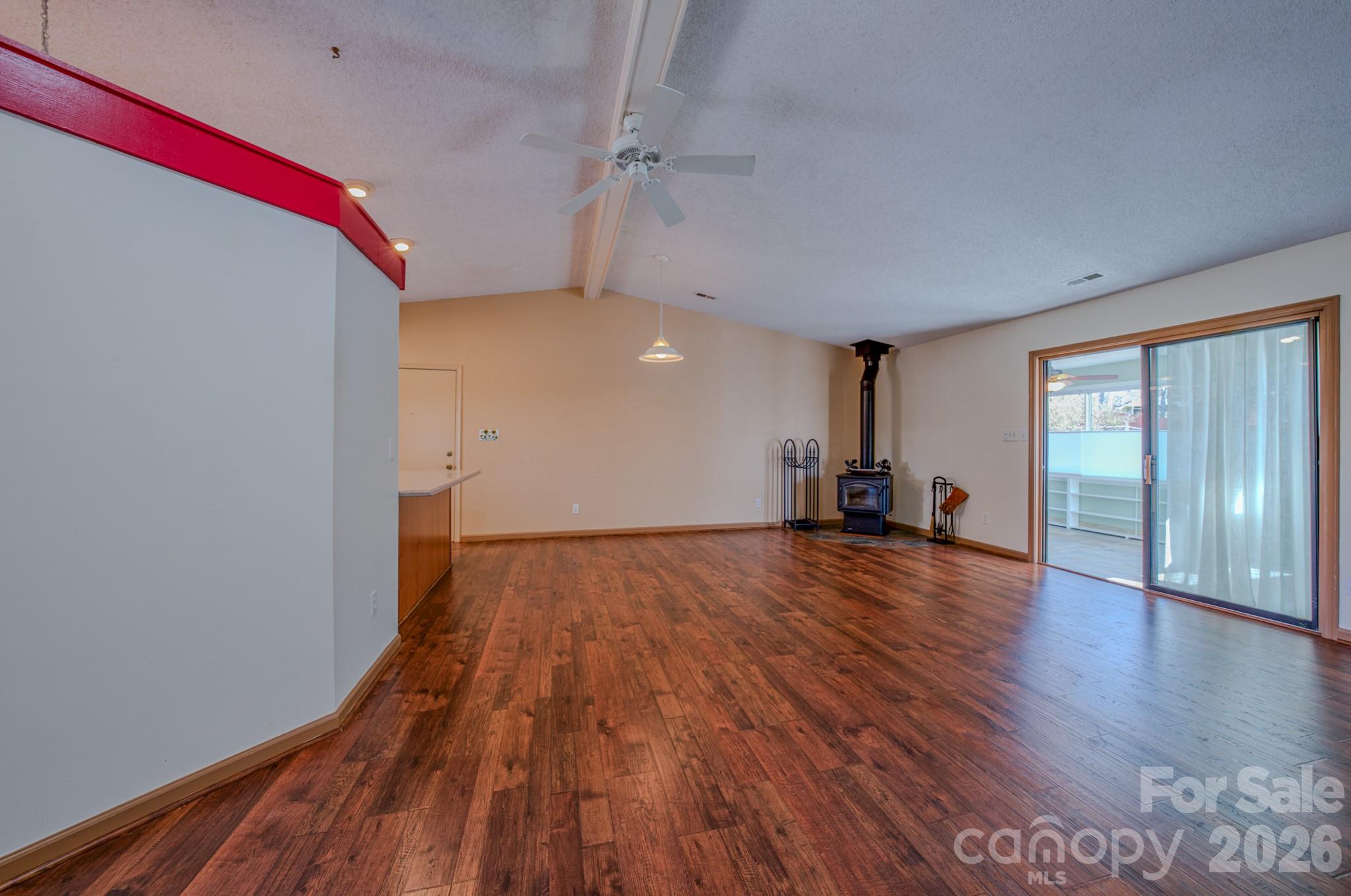 31 Knoll Ridge Drive Asheville, NC 28804 - Photo 10 of 30 a view of empty room with wooden floor and fan