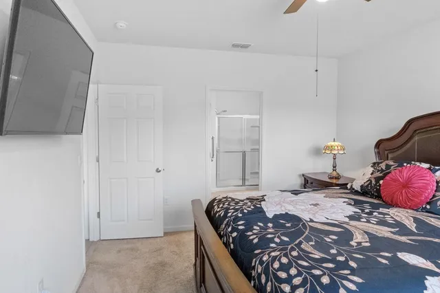 a bedroom with a bed and dresser