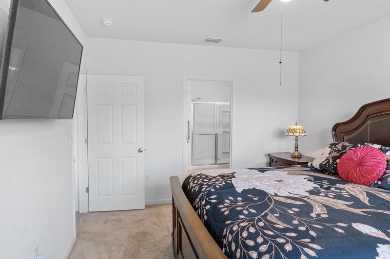 1836 Barber Street Sebastian, FL 32958 - Photo 12 of 29 a bedroom with a bed and dresser