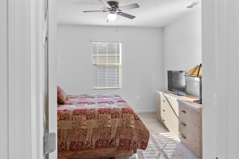 1836 Barber Street Sebastian, FL 32958 - Photo 16 of 29 a bedroom with a bed and a window