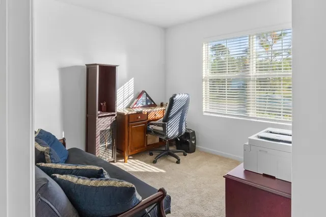 a room with furniture and a window