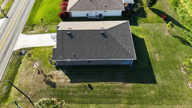 an aerial view of a house having yard