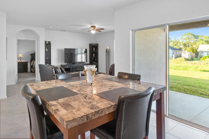 1836 Barber Street Sebastian, FL 32958 - Photo 6 of 29 a dining room with furniture and wooden floor
