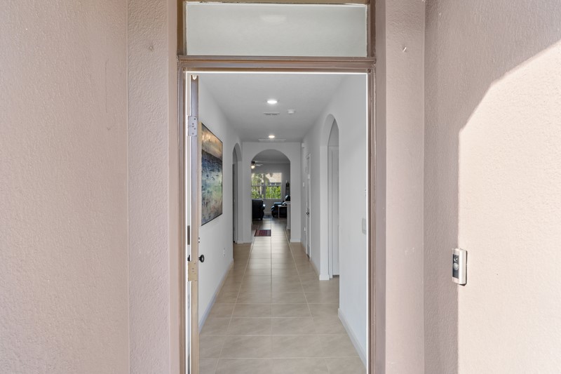1836 Barber Street Sebastian, FL 32958 - Photo 10 of 29 a view of a hallway with wooden floor and staircase
