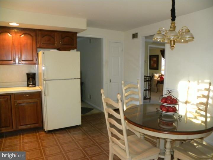 425 Township Line Road Eagleville, PA 19403 - Photo 14 of 20 a kitchen with a refrigerator and a stove top oven