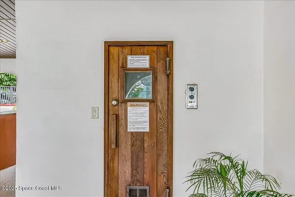 a view of entryway with wooden floor
