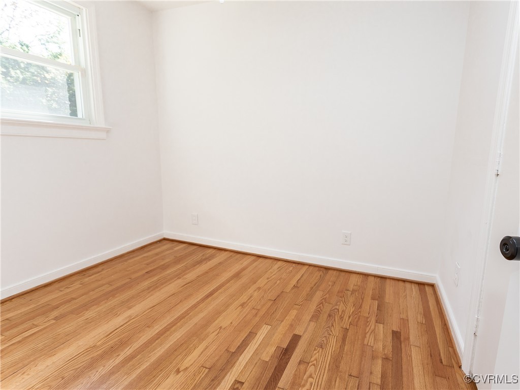 3311 Croydon Road Richmond, VA 23223 - Photo 16 of 23 a view of empty room with wooden floor and fan