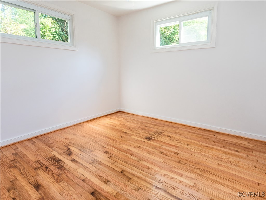 3311 Croydon Road Richmond, VA 23223 - Photo 17 of 23 an empty room with wooden floor and windows