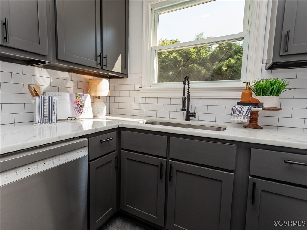 3311 Croydon Road Richmond, VA 23223 - Photo 7 of 23 a kitchen with stainless steel appliances granite countertop a sink a stove and cabinets