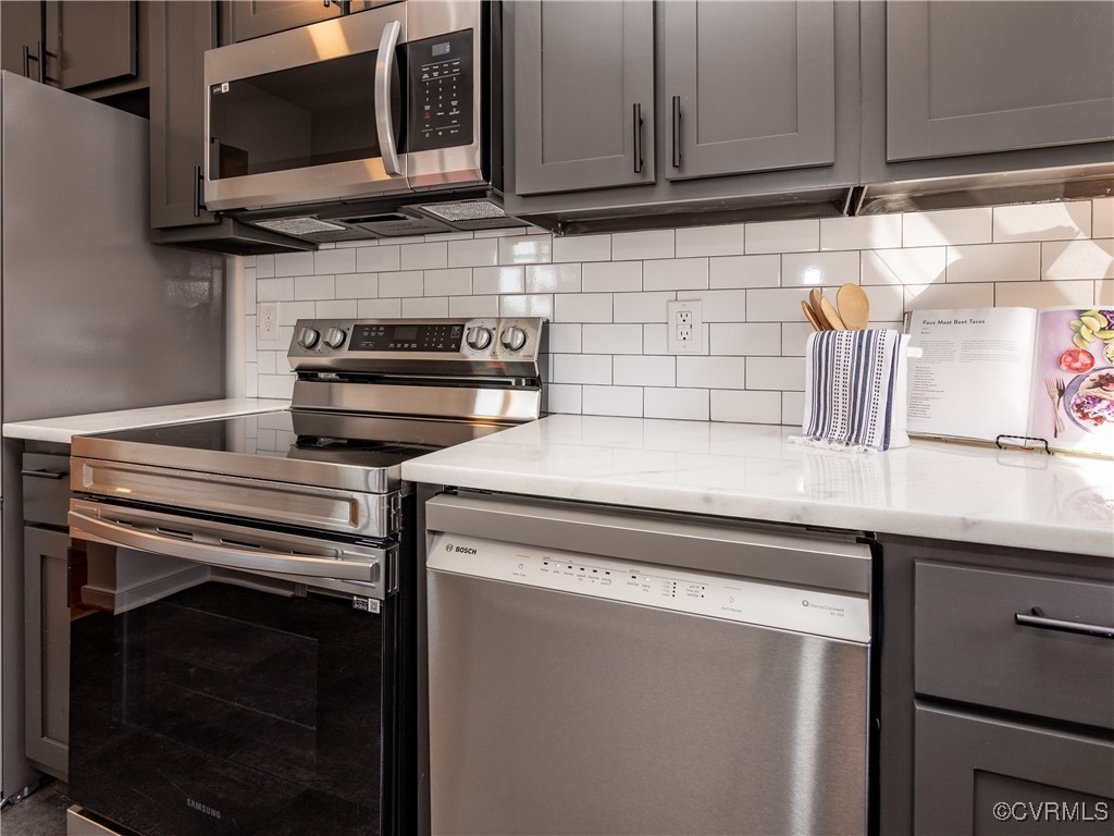 3311 Croydon Road Richmond, VA 23223 - Photo 9 of 23 a kitchen with wooden cabinets and a stove top oven