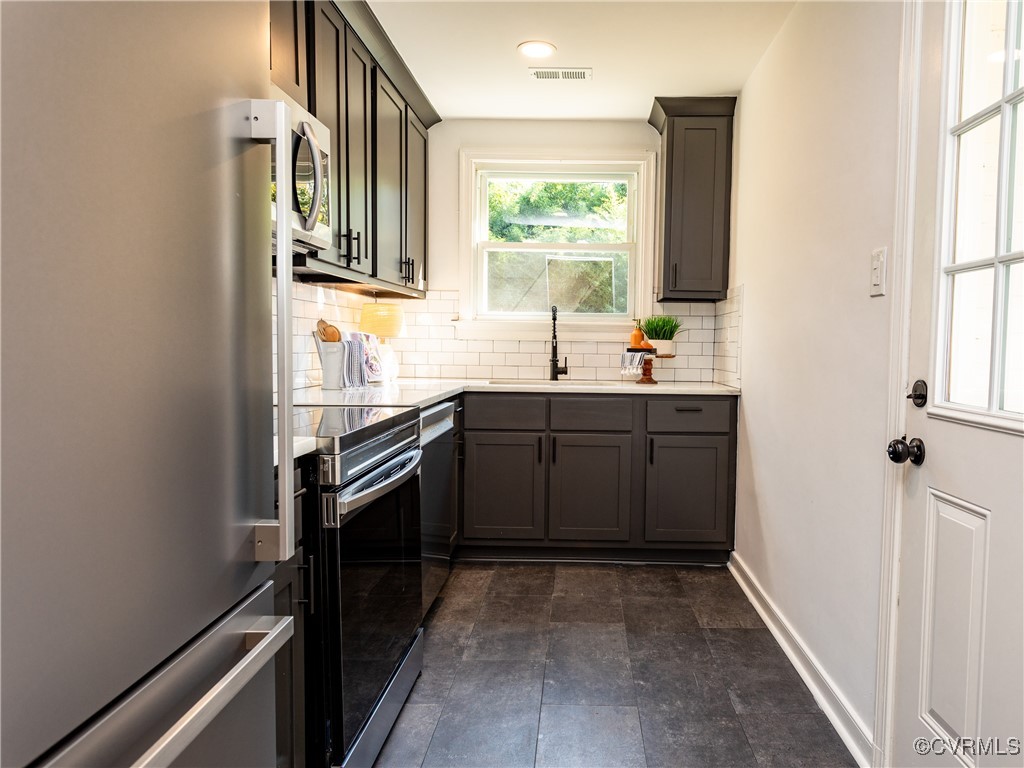 3311 Croydon Road Richmond, VA 23223 - Photo 10 of 23 a kitchen with a sink stove and cabinets