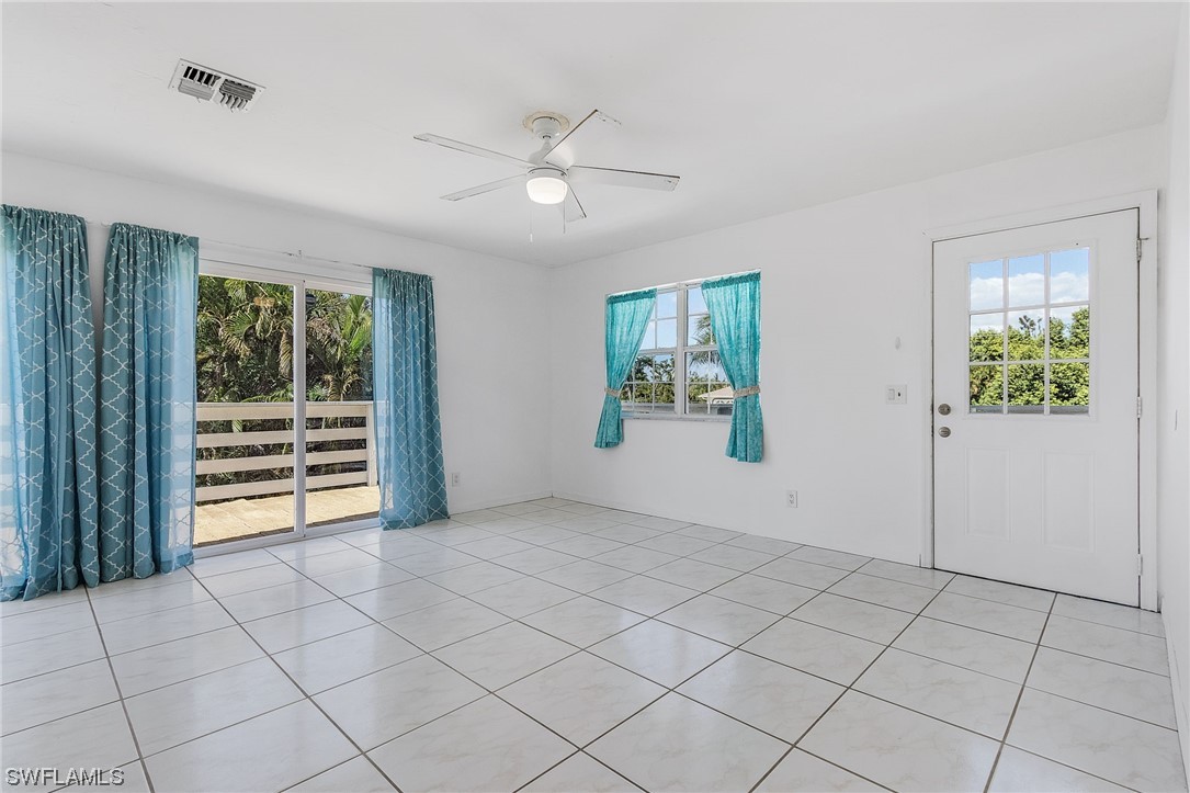 5823 Trout Road Bokeelia, FL 33922 - Photo 5 of 29 an empty room with windows and closet