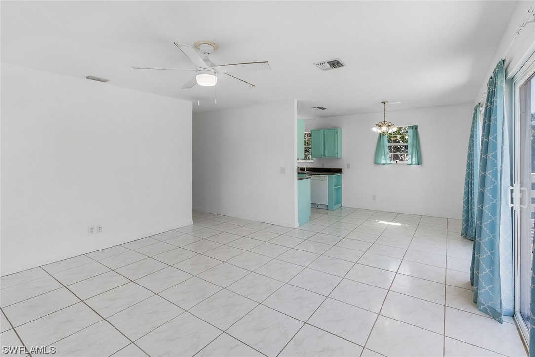 5823 Trout Road Bokeelia, FL 33922 - Photo 9 of 29 an empty room with cabinet and mirrors