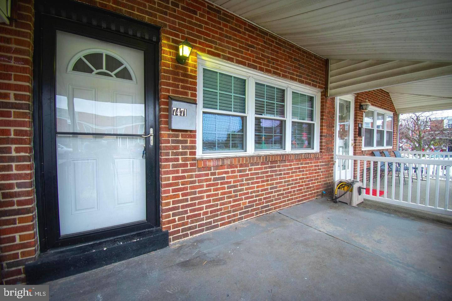7471 Rabon Avenue Dundalk, MD 21222 - Photo 2 of 6 a view of a porch with a door