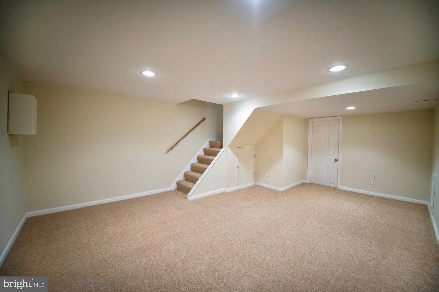 7471 Rabon Avenue Dundalk, MD 21222 - Photo 5 of 6 an empty room with white walls and white walls