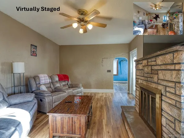 a living room with furniture and a fireplace