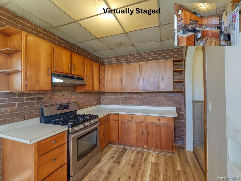 6 Willow Street Newburgh, NY 12550 - Photo 4 of 24 a kitchen with a stove a refrigerator and cabinets