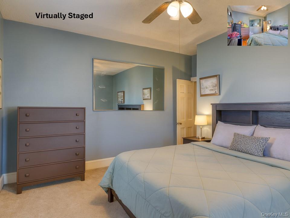 6 Willow Street Newburgh, NY 12550 - Photo 7 of 24 a bedroom with a bed and a chandelier