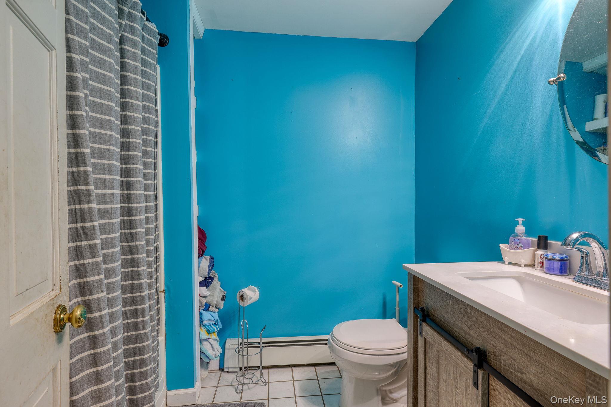 6 Willow Street Newburgh, NY 12550 - Photo 10 of 24 a bathroom with a sink and a toilet