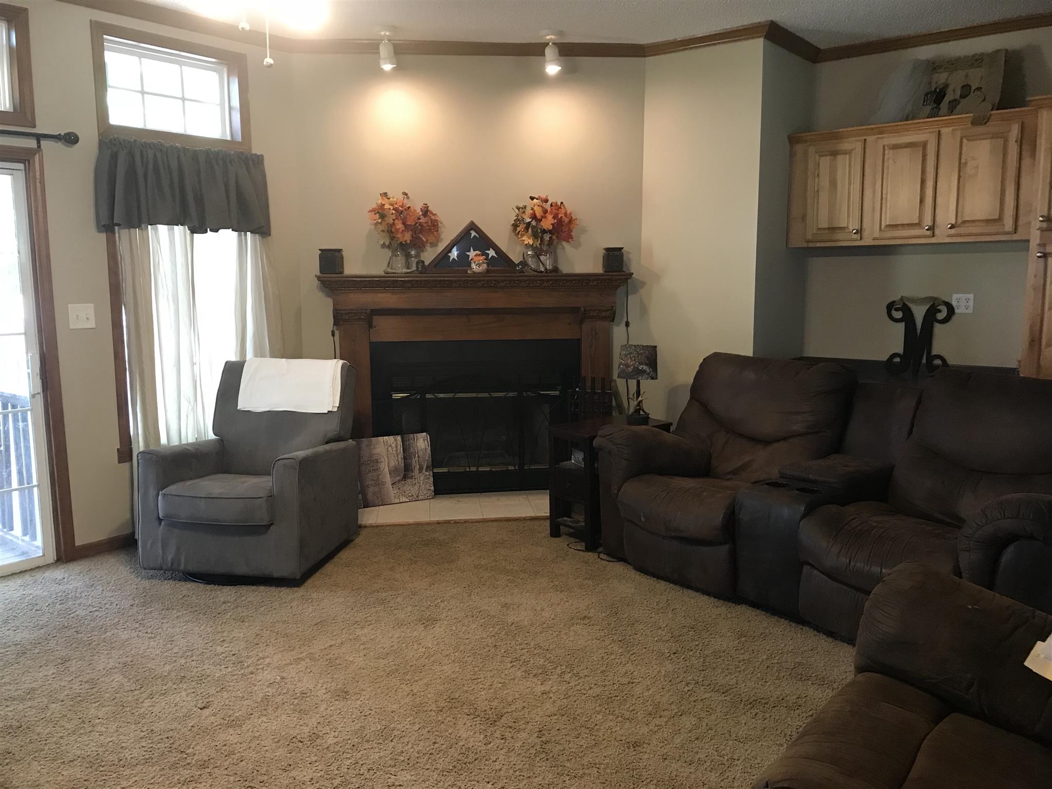 1237 Fowler Ford Road Portland, TN 37148 - Photo 4 of 17 a living room with furniture a fireplace and a window