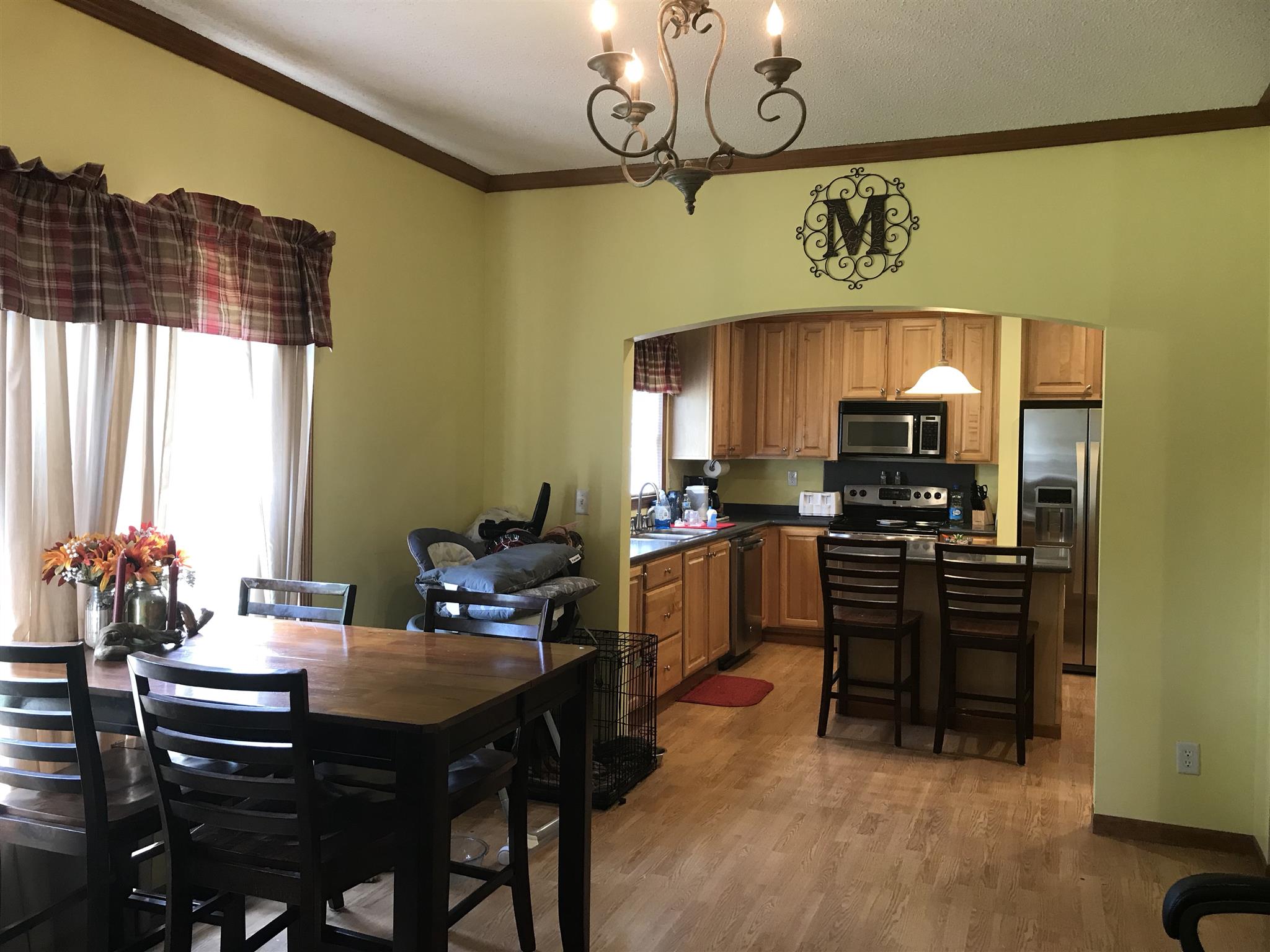 1237 Fowler Ford Road Portland, TN 37148 - Photo 6 of 17 a kitchen with a refrigerator and a stove top oven
